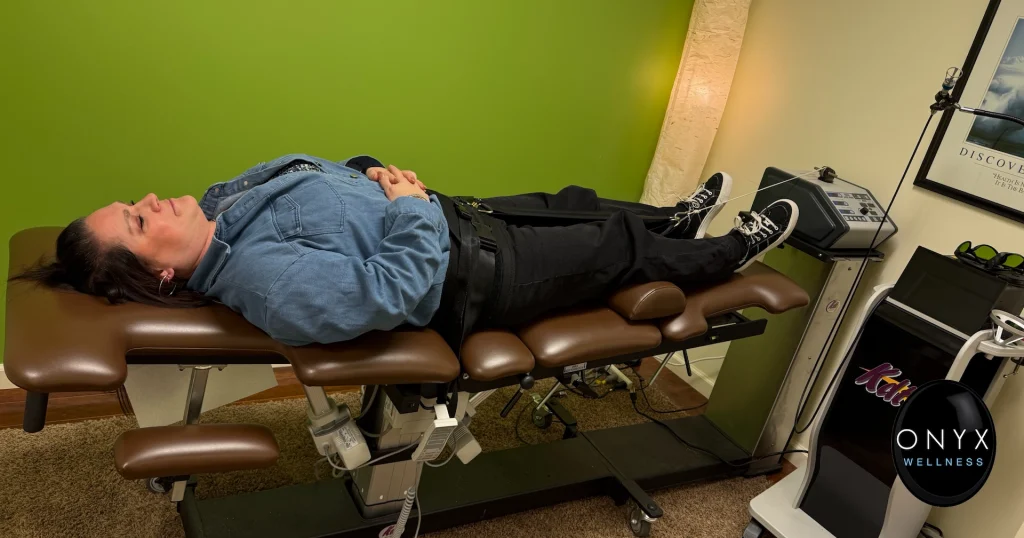 chiropractic patient receiving decompression therapy using a traction machine to relieve spinal pain