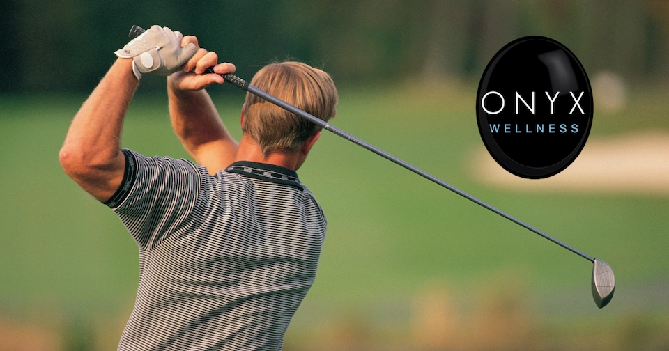 man swinging a golf club and enjoying a round of golf pain free