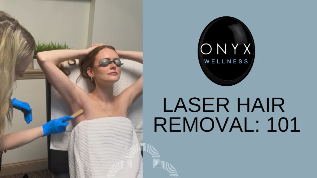 Onyx Wellness technician places hot wax on the underarm of a female patient with arms above head in a towel before her laser hair removal treatment